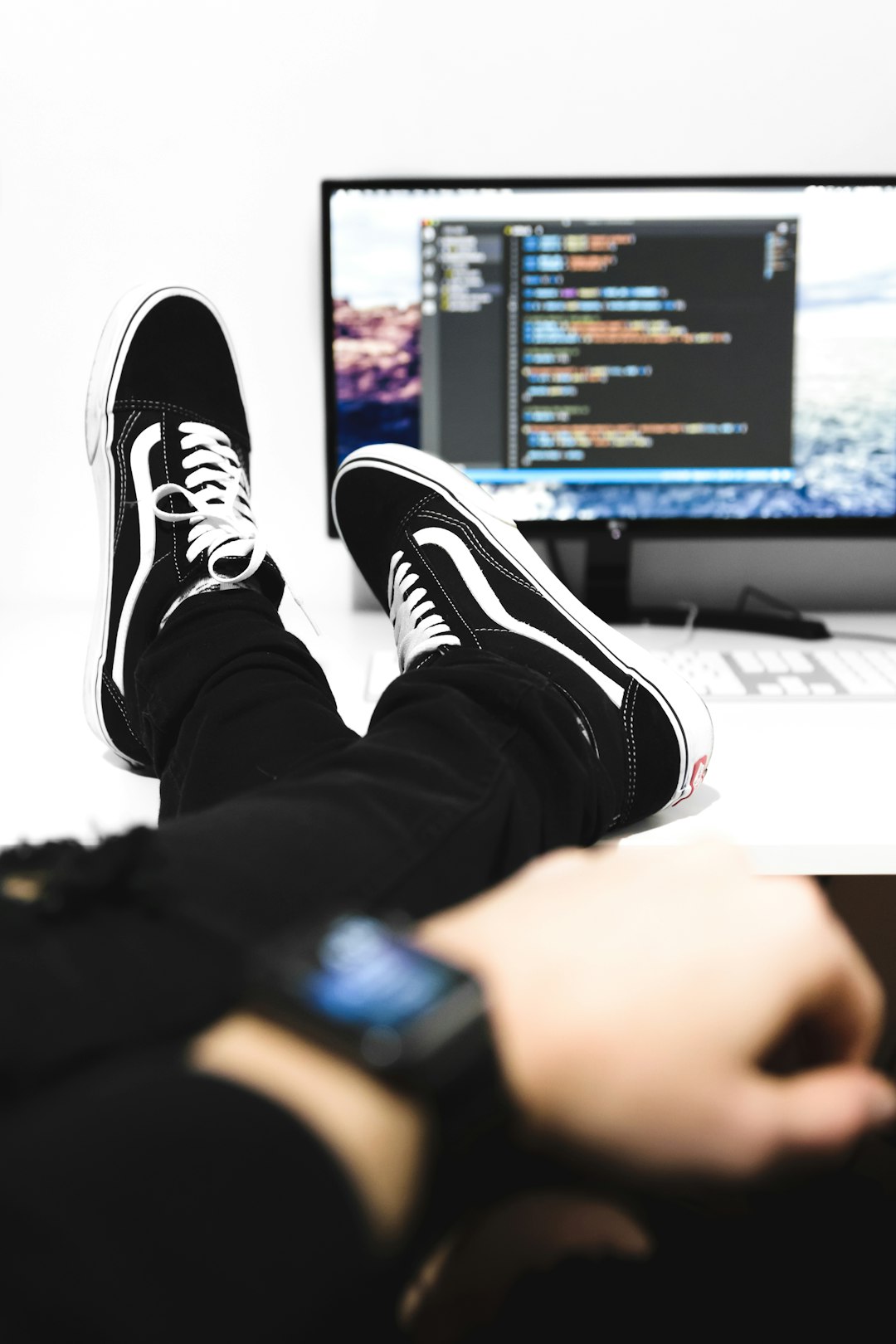 a-person-sitting-in-front-of-a-computer-monitor-edibgcuohrq