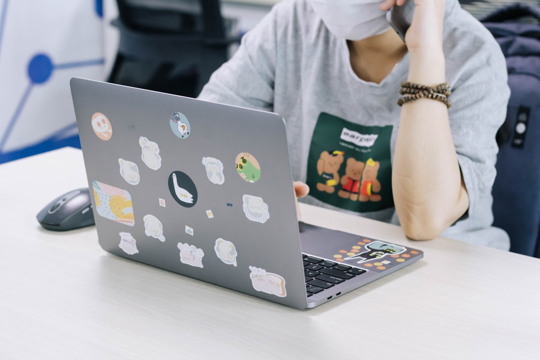 woman-in-white-hijab-using-macbook-pro-rmcpnl8rkom